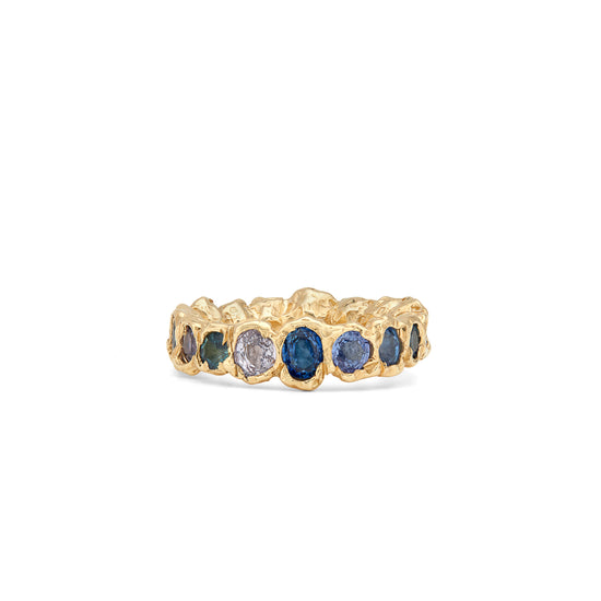 Our colorful statement, Freja Rainbow ring in 14-karat gold with Sapphires in a palette of blue shades. This cocktail ring has Fie Isolde's raw signature finish resembling liquid gold. The ring comes in a variety of different colors so if you do not see the color you would like, please contact us. PRODUCT DETAILS:   Ring in 14-karat gold with blue Sapphires.  Handmade in Los Angeles SIZE & MEASUREMENTS:  Ring hight: 6 mm  